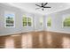 Bright bedroom boasts large windows, recessed lighting, and tray ceiling with fan at 1903 Edgerton Dr, Durham, NC 27703