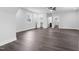 Spacious bedroom featuring hardwood floors, ceiling fan and access to a walk in closet and bathroom at 1903 Edgerton Dr, Durham, NC 27703