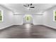Large bonus room features gray wood-look floors, recessed lighting, and built-in shelving at 1903 Edgerton Dr, Durham, NC 27703