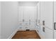 Spacious walk-in closet with custom built-in storage and hardwood floors at 1903 Edgerton Dr, Durham, NC 27703