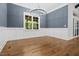 Dining room features paneled walls, elegant chandelier, and large window with views at 1903 Edgerton Dr, Durham, NC 27703
