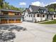 A well-manicured lawn leads to a home with a matching detached three-car garage at 1903 Edgerton Dr, Durham, NC 27703