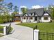 Charming two-story home with manicured lawn, brick accents, and a grand entrance at 1903 Edgerton Dr, Durham, NC 27703