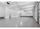 Spacious garage with epoxy flooring, ample storage space, and access to the main house and side yard at 1903 Edgerton Dr, Durham, NC 27703