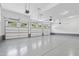 Large garage with multiple car capacity, epoxy flooring, and well-lit interior, perfect for storage and projects at 1903 Edgerton Dr, Durham, NC 27703