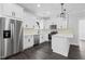 Bright kitchen with stainless steel appliances, white cabinets, and a functional layout perfect for cooking and entertaining at 1903 Edgerton Dr, Durham, NC 27703