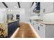 Bright kitchen boasts custom cabinets, stainless appliances, granite counters, and hardwood floors at 1903 Edgerton Dr, Durham, NC 27703