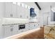 Modern kitchen with white cabinets, stainless steel appliances, and a unique island at 1903 Edgerton Dr, Durham, NC 27703