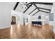 Open floor plan with kitchen, dining and living areas including high ceilings, wood beams and fireplace at 1903 Edgerton Dr, Durham, NC 27703