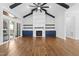 Spacious living room with high ceilings, wood beams, fireplace, and sliding doors to porch at 1903 Edgerton Dr, Durham, NC 27703