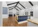 Spacious living room featuring wood floors, a fireplace, and an island with bar seating at 1903 Edgerton Dr, Durham, NC 27703