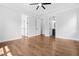 Bright main bedroom features hardwood floors, tray ceiling, and ensuite bathroom and walk-in closet access at 1903 Edgerton Dr, Durham, NC 27703