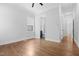 Spacious main bedroom with hardwood flooring, neutral walls, with ensuite bathroom access at 1903 Edgerton Dr, Durham, NC 27703