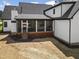 A screened porch offers outdoor living and dining at 1903 Edgerton Dr, Durham, NC 27703
