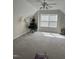 Large bedroom with an attic roof, carpet, and a ceiling fan at 204 Plank Bridge Way, Morrisville, NC 27560
