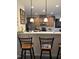 Eat-in kitchen bar area with pendant lighting and stainless steel appliances at 204 Plank Bridge Way, Morrisville, NC 27560