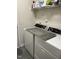 Well-stocked laundry room with a wire shelf, washer, and dryer at 204 Plank Bridge Way, Morrisville, NC 27560