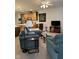 Living area showcases comfortable seating, wood accents and seamless transition to kitchen at 204 Plank Bridge Way, Morrisville, NC 27560