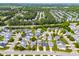 Areal view of a residential neighborhood with tree-lined streets and sidewalks at 210 Millet Dr, Morrisville, NC 27560