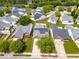 Aerial view of a home with solar panels and a tree-lined street at 210 Millet Dr, Morrisville, NC 27560