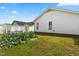 Backyard features lush garden, a white fence and green lawn at 210 Millet Dr, Morrisville, NC 27560