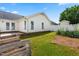 Landscaped backyard features a white vinyl fence, a garden and green lawn at 210 Millet Dr, Morrisville, NC 27560