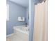 Bathroom featuring a soaking tub with a shower curtain at 210 Millet Dr, Morrisville, NC 27560