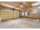 Spacious two-car garage with ample storage space and an electric vehicle charger at 210 Millet Dr, Morrisville, NC 27560