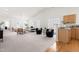 Spacious living room with high ceilings and stylish furnishings adjoining the kitchen at 210 Millet Dr, Morrisville, NC 27560