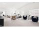 Spacious living room featuring neutral decor, ample natural light, comfortable seating, and vaulted ceilings at 210 Millet Dr, Morrisville, NC 27560