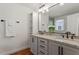 Modern bathroom featuring double vanity, granite countertops, and stylish fixtures at 2114 Woodview Dr, Raleigh, NC 27604