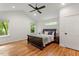 Spacious bedroom with hardwood floors, vaulted ceilings, and natural light at 2114 Woodview Dr, Raleigh, NC 27604