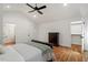 Well-lit bedroom with hardwood floors, a vaulted ceiling, and ample storage space at 2114 Woodview Dr, Raleigh, NC 27604
