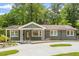 Charming single-story home with a well-manicured lawn and a welcoming front porch at 2114 Woodview Dr, Raleigh, NC 27604