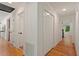 Bright hallway featuring hardwood floors, and access to other areas of the home at 2114 Woodview Dr, Raleigh, NC 27604