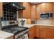 Well-equipped kitchen with stainless steel appliances, light countertops, and ample cabinet space at 2114 Woodview Dr, Raleigh, NC 27604