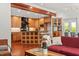 Open-concept kitchen and living area featuring wood cabinets, an island, and modern appliances at 2114 Woodview Dr, Raleigh, NC 27604