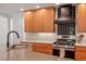 Modern kitchen featuring stainless steel appliances, granite countertops, and stylish cabinetry at 2114 Woodview Dr, Raleigh, NC 27604