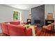 Bright living room with a modern fireplace, hardwood floors, and comfortable seating at 2114 Woodview Dr, Raleigh, NC 27604