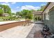 Tranquil outdoor patio area with stone pavers, a rock fountain, and verdant landscaping at 2114 Woodview Dr, Raleigh, NC 27604