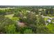 Aerial view of a home nestled among mature trees in a green landscape at 213 Old Mallard Rd, Smithfield, NC 27577