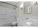 Bright bathroom with white vanity, shower and tub combo, and neutral walls at 213 Old Mallard Rd, Smithfield, NC 27577