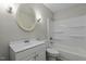 Standard bathroom with a vanity, oval mirror, and a shower-tub combo at 213 Old Mallard Rd, Smithfield, NC 27577
