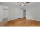Bright bedroom featuring hardwood floors, neutral paint, and closet at 213 Old Mallard Rd, Smithfield, NC 27577