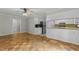 Spacious living room with hardwood floors, view of kitchen, neutral paint, and ample natural light at 213 Old Mallard Rd, Smithfield, NC 27577