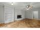 Bright living room with hardwood floors, white painted brick fireplace, and built-in shelving at 213 Old Mallard Rd, Smithfield, NC 27577