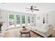 Inviting living room with lots of natural light, hardwood floors, and access to a deck at 2169 Rawls Church Rd, Angier, NC 27501