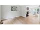 Open-concept space with wood floors, fireplace, and view of another room at 2169 Rawls Church Rd, Angier, NC 27501