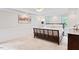 Spacious main bedroom with a tray ceiling, carpeted floors, and natural light at 2169 Rawls Church Rd, Angier, NC 27501