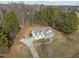 Aerial view showcasing the house, long driveway and the spacious front yard at 226 Fletcher Ridge Rd, Timberlake, NC 27583